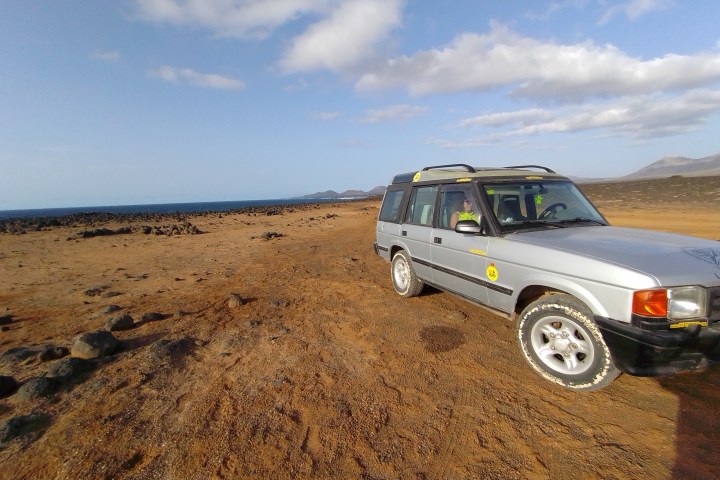 a car parked on a dirt road